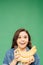 Excited adorable child holding bananas isolated