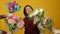 Excited adult woman accepting flowers and laughing at camera