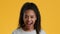 Excited African American Adolescent Girl Looking Opening Mouth, Yellow Background