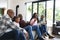 Excited african american parents, son, daughter and grandparents watching sport on tv, slow motion