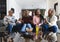 Excited african american parents, son, daughter and grandparents watching sport on tv, slow motion