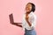 Excited Afro Girl Holding Laptop Gesturing Yes, Studio Shot