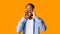 Excited Afro Guy Shouting Standing Over Orange Studio Background, Panorama