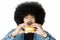 Excited Afro man eating a burger