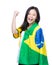 Excited asia woman draped with Brazil flag