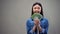 Excited asian woman showing euro banknotes on camera, lottery winner, fortune