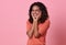 Excited beautiful african woman happiness wearing casual orange t-shirt  on pink background