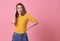 Excited beautiful woman happiness wearing casual yellow t-shirt  on pink background