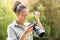 Excited black photographer checking result in a park