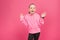 excited blonde child gesturing and looking at camera, isolated