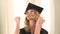 Excited blonde woman graduate