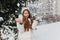 Excited brightful image of joyful amazing pretty winter girl having fun with snow outdoor on street. Happy moments, play