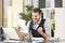 Excited businessman reading a letter at office