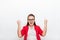 Excited businesswoman hold hands fist up happy smile wear red jacket glasses