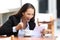 Excited businesswoman reading a letter outdoors