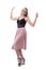 Excited cheerful young blonde stylish fashionable woman with raised arms.