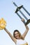 Excited Cheerleader Holding Trophy