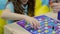 Excited child playing board game, learning process, upbringing