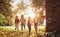 Excited children with backpacks enjoying walk in forest on sunny autumn day, kids exploring nature