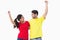 Excited couple cheering in red and yellow tshirts