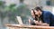 Excited couple finding online content in a laptop