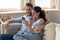 Excited couple triumph reading good news on smartphone