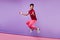 Excited curly black guy expressing amazement. Indoor photo of jumping funny african young man.