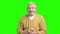 Excited elderly man on green screen.