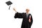 Excited elderly man wearing a grraduation gown, throwing hat and holding a diploma