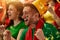 Excited and emotional people, portugal football fans emotionally cheering up favourite team during match at stadium