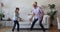 Excited energetic rocker grandpa and grandkid dancing to rock music