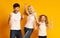 Excited Family Gesturing Yes Shaking Fists On Yellow Background