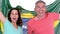 Excited football fan couple holding brazil flag