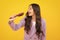 Excited fun teenager girl singing with comb. Child girl with brush combing hair. Girl taking haircare and hairstyle.