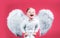 Excited funny angel children boy with white wings laughing. Valentines day cupid child.