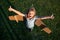 Excited funny child boy flying in plane made craft of cardboard wings. Dream, imagination, childhood. Boy dreams of