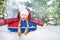 Excited girl on snow tube in winter during day