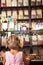 Excited Girl Standing In Sweet Shop