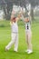 Excited golfing couple cheering