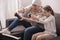 excited grandmother and granddaughter playing with joysticks cancer concept