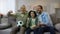 Excited grandpa, dad and son happy for national football team winning game, home