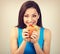 Excited happy hungry woman wanting to bite tasty burger on blue background. Closeup