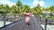 Excited happy Summer travel vacation concept video with woman cheering running and dancing joyful excited to be at