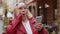 Excited happy winner senior woman use smartphone celebrating win good message news in city street