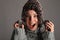 Excited happy young girl in warm winter wool hat