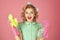 Excited housekeeper woman in uniform with clean spray, sponge. Pinup woman hold soup bottle, sponge. Cleanup, cleaning