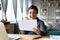 Excited Indian girl reading good news in letter