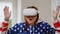 Excited joyful mature woman in VR headset smiling gaming online in augmented reality. Portrait of satisfied happy