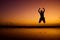 Excited Jump in the beach under sunset