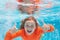 Excited kid boy with thumbs up swim and dive underwater, kid with fun in pool under water. Active healthy lifestyle